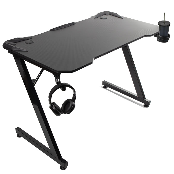 Maximera din spelupplevelse med Svart Gamingbord från NanoRS. Stödjer upp till 150 kg, justerbar höjd (750 mm), rymlig (110x60x1,5 cm), med mugghållare och hörlurshållare. Modell: RS345.