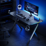 NanoRS gaming desk, svart, med hörlurs- och mugghållare, RGB-bakgrundsbelysning, max. 75kg, mått 1200x600x750mm, RS102